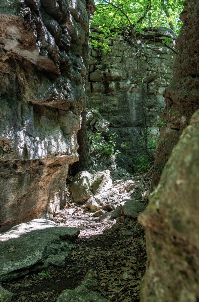 A narrow passage between rock walls